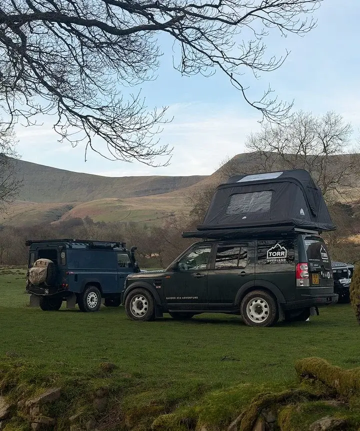 Land Rover Discovery with a roof tent, filming product content in the Brecon Beacons